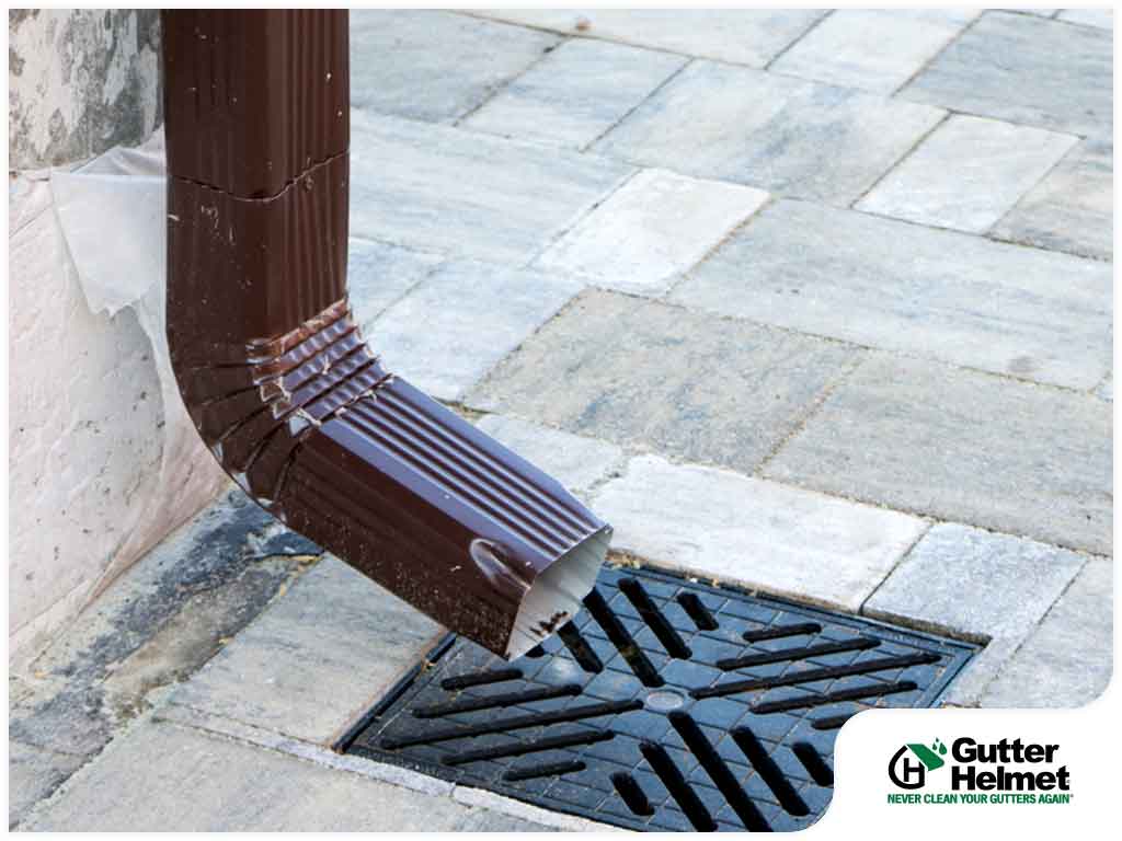 How Do Gutters and Downspouts Deliver Rainwater?