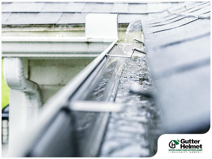 What Causes Water to Leak Behind Your Gutters?